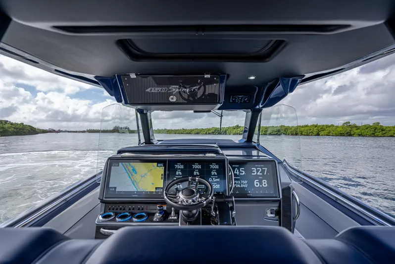  Yacht Photos Pics 2024 Nor-Tech 450 Sport Center Console dashboard with advanced navigation and controls on open water.