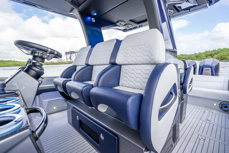  Yacht Photos Pics 2024 Nor-Tech 450 Sport Center Console interior with luxurious seating and modern design.
