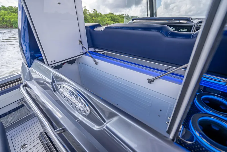  Yacht Photos Pics 2024 Nor-Tech 450 Sport Center Console interior with open storage compartment and blue accents.