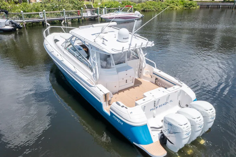  Yacht Photos Pics 2018 Intrepid 430 Sport Yacht with triple outboard engines on calm water.