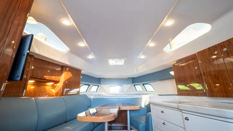  Yacht Photos Pics Luxurious interior of 2018 Intrepid 430 Sport Yacht with elegant seating and cabinetry.