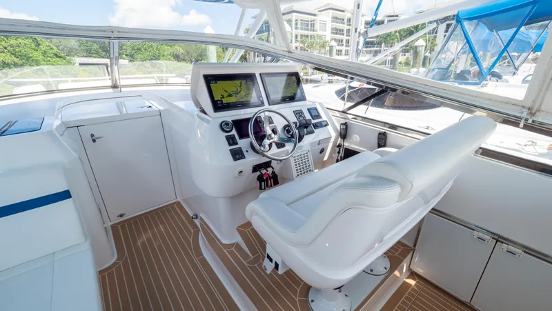  Yacht Photos Pics 2018 Intrepid 430 Sport Yacht helm with dual screens and white seating.