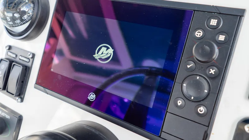  Yacht Photos Pics Control panel of a 2018 Intrepid 430 Sport Yacht with digital display and navigation controls.