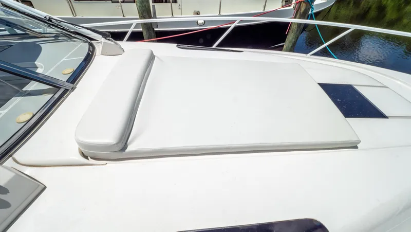  Yacht Photos Pics 2018 Intrepid 430 Sport Yacht sunpad on deck, featuring sleek design and comfortable seating.