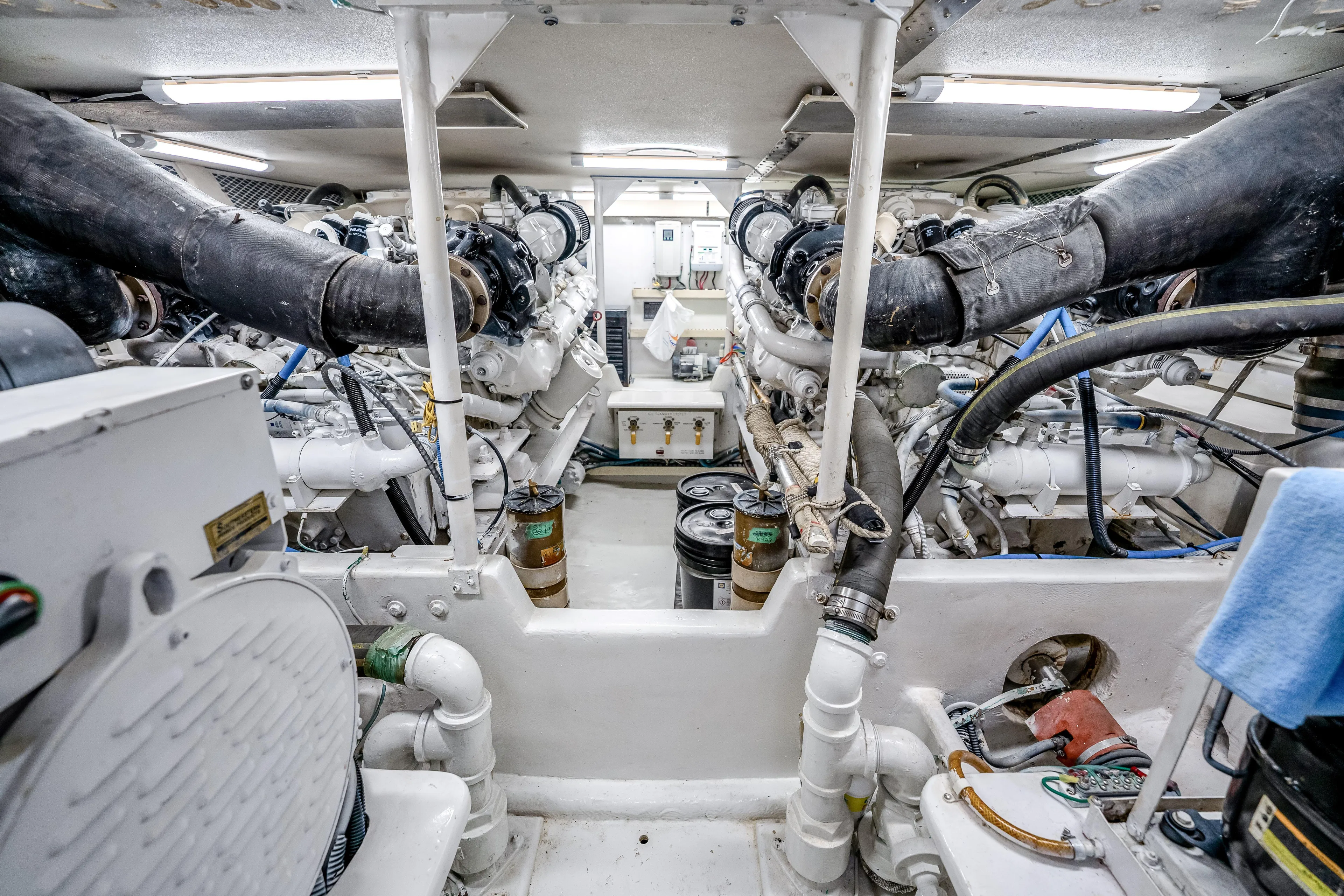 Second Chance Yacht Photos Pics Engine room of a 1995 Viking 50 yacht, showcasing complex machinery and piping.