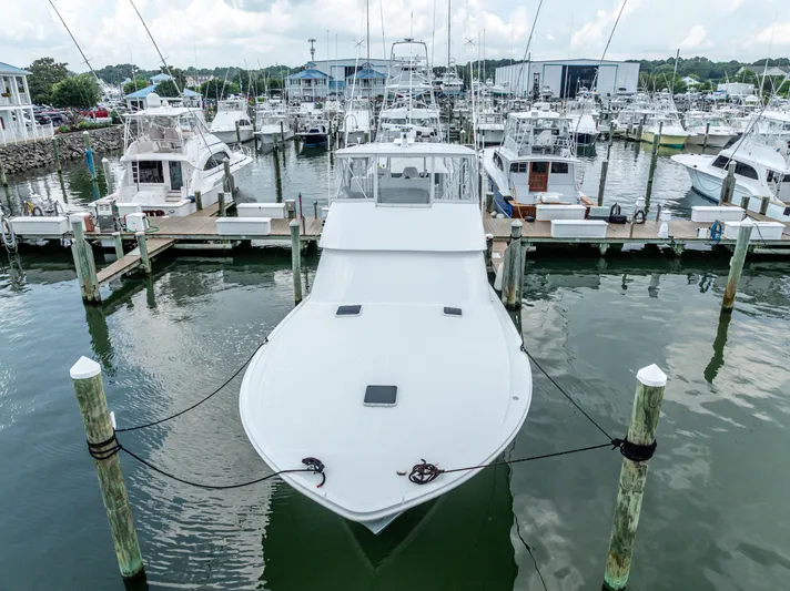 Second Chance Yacht Photos Pics A 1995 Viking 50 yacht docked at a marina, surrounded by other boats.