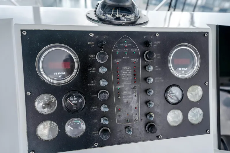 Second Chance Yacht Photos Pics Control panel of a 1995 Viking 50 boat with RPM gauges and switches.