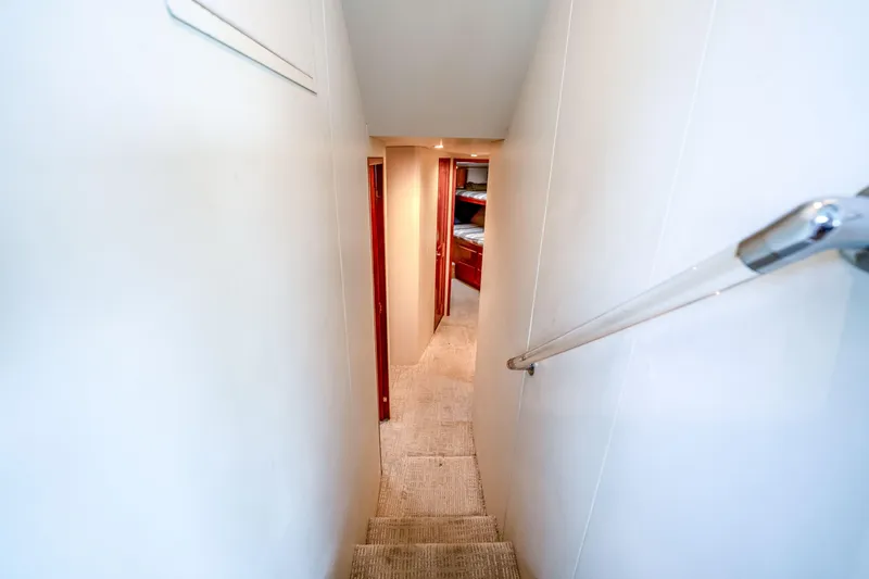 Second Chance Yacht Photos Pics Narrow hallway inside 1995 Viking 50 yacht, leading to cozy cabin area.