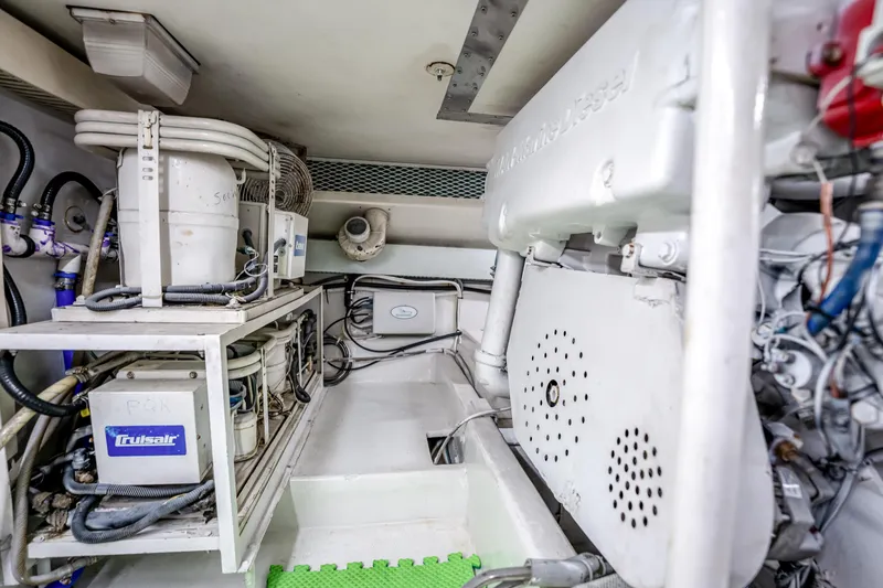 Second Chance Yacht Photos Pics Engine room of a 1995 Viking 50 yacht, featuring mechanical equipment and piping.