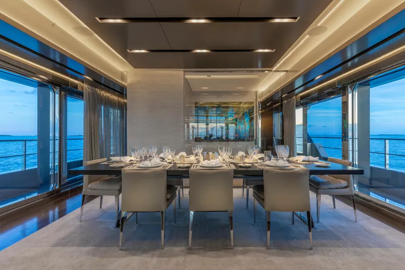 Safe Haven Yacht Photos Pics Luxurious yacht dining room with elegant table setting, panoramic ocean views, and modern design.