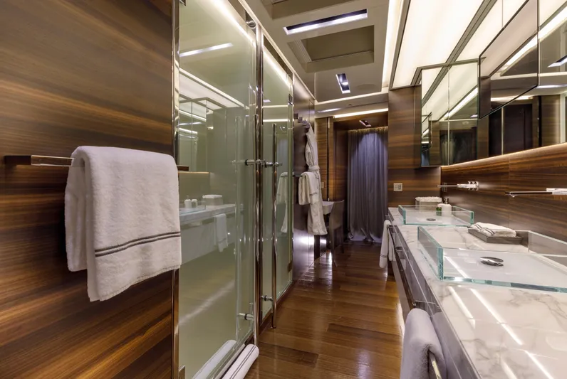 Safe Haven Yacht Photos Pics Luxurious yacht bathroom with wood paneling, glass shower, and marble countertops, Admiral Custom 2015.