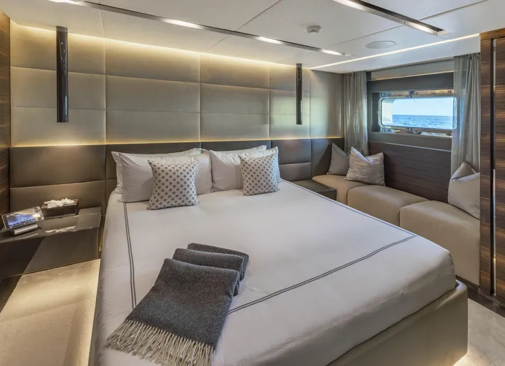 Safe Haven Yacht Photos Pics Luxurious yacht bedroom interior with modern design, featuring a large bed and ocean view window.