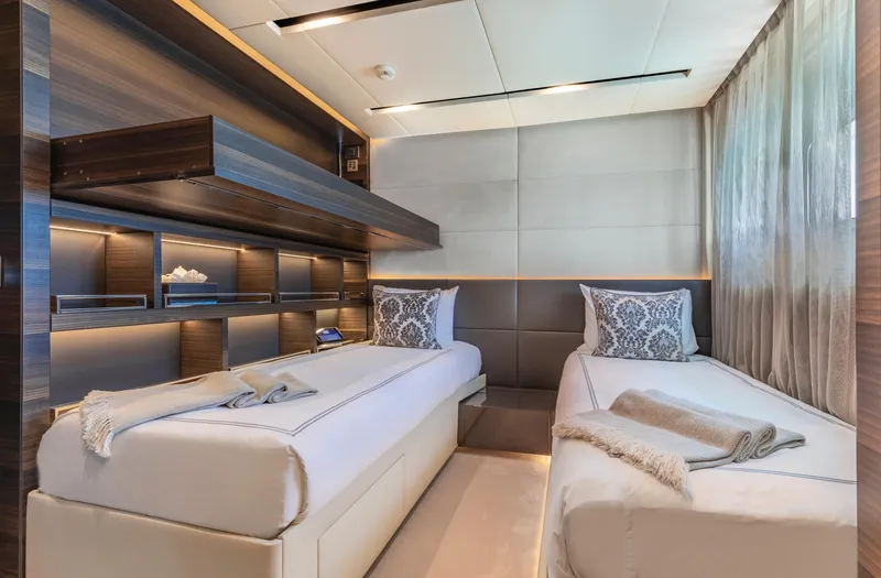Safe Haven Yacht Photos Pics Luxurious twin bedroom in 2015 Admiral Custom yacht with modern decor and ambient lighting.