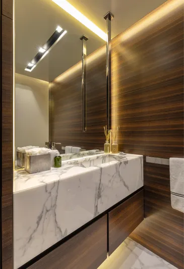 Safe Haven Yacht Photos Pics Luxurious modern bathroom with marble sink, wooden paneling, and ambient lighting, Admiral Custom 2015 design.