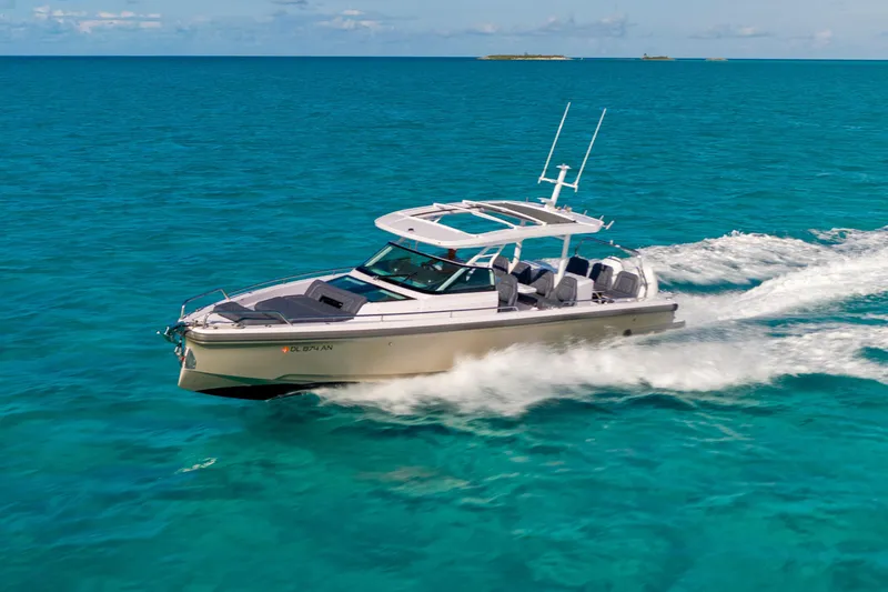 Safe Haven Yacht Photos Pics Admiral Custom 2015 boat cruising on clear turquoise waters under a sunny sky.