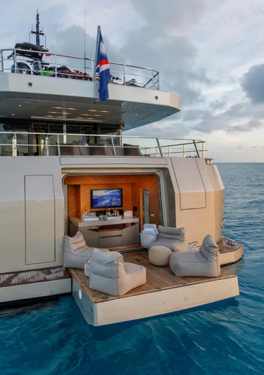 Safe Haven Yacht Photos Pics Luxurious 2015 Admiral Custom yacht with outdoor lounge area on calm ocean waters.