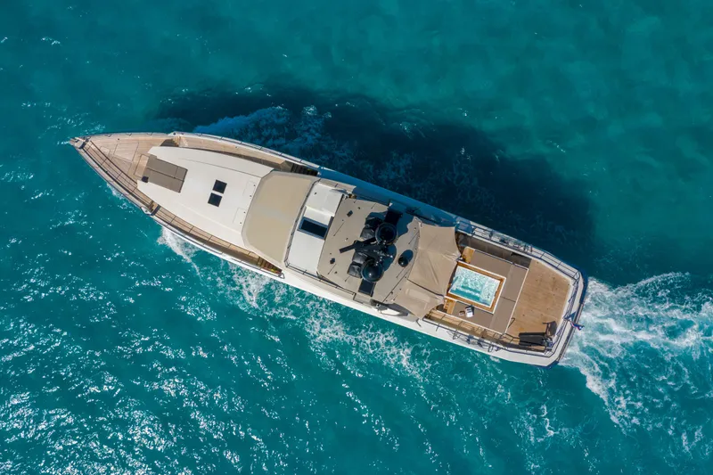 Safe Haven Yacht Photos Pics Aerial view of 2015 Admiral Custom yacht cruising in clear blue waters.