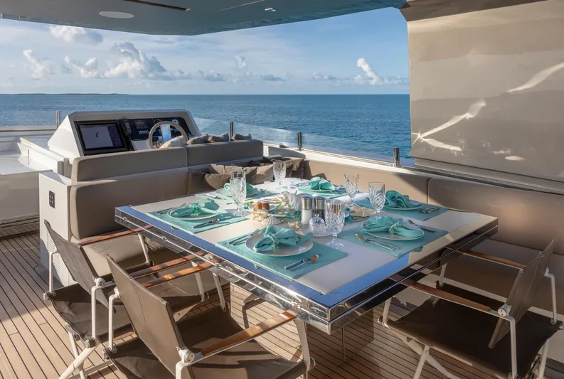 Safe Haven Yacht Photos Pics Luxurious dining setup on 2015 Admiral Custom yacht with ocean view.