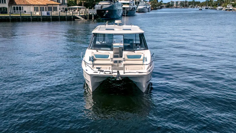  Yacht Photos Pics 2019 Aquila 36 Sport catamaran on calm water, dockside view.
