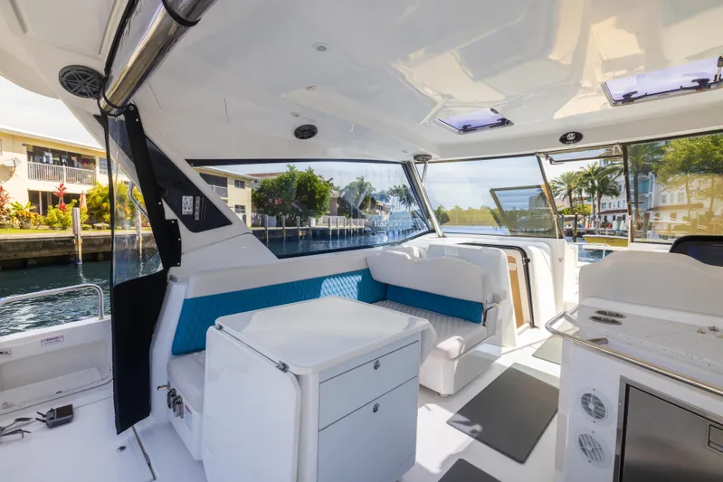  Yacht Photos Pics Interior of 2019 Aquila 36 Sport yacht with modern seating and waterfront view.