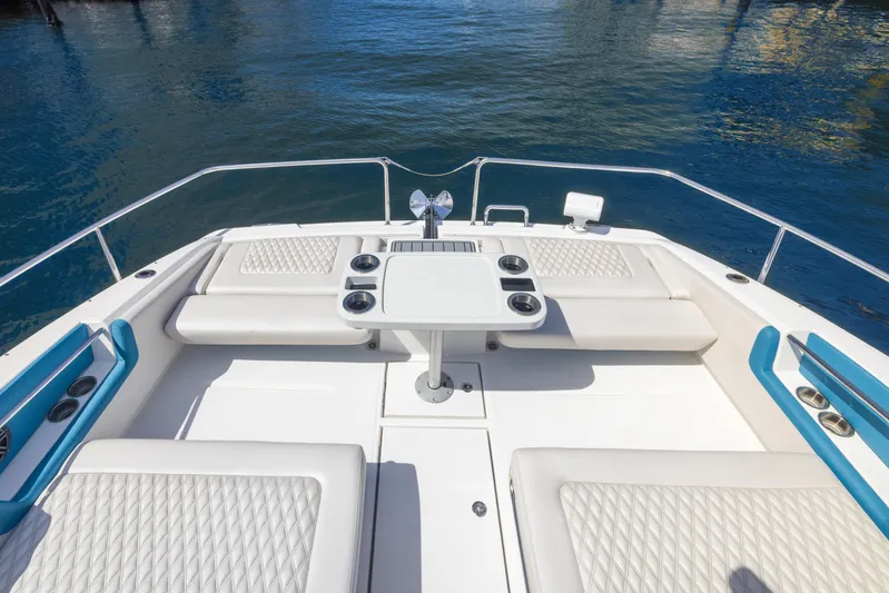  Yacht Photos Pics Aquila 36 Sport 2019 boat deck with seating and table on calm water.
