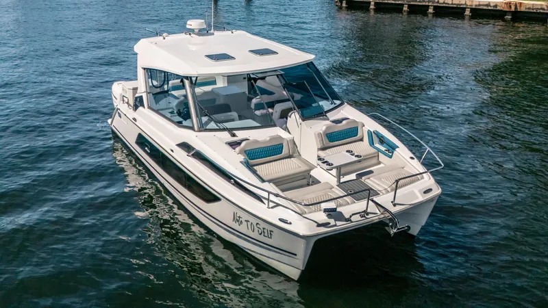  Yacht Photos Pics 2019 Aquila 36 Sport boat on water, featuring sleek design and spacious deck.