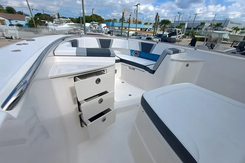360-105 Yacht Photos Pics 2026 Robalo R360 Center Console boat interior with seating and storage drawers.