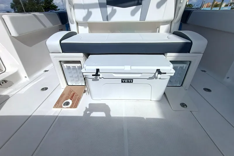 360-105 Yacht Photos Pics 2026 Robalo R360 Center Console boat interior with Yeti cooler and seating area.