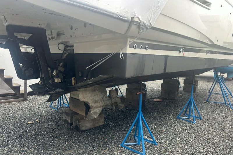 World Wide Yacht Photos Pics 2020 Prestige 460 yacht on stands for maintenance, showing hull and propeller area.