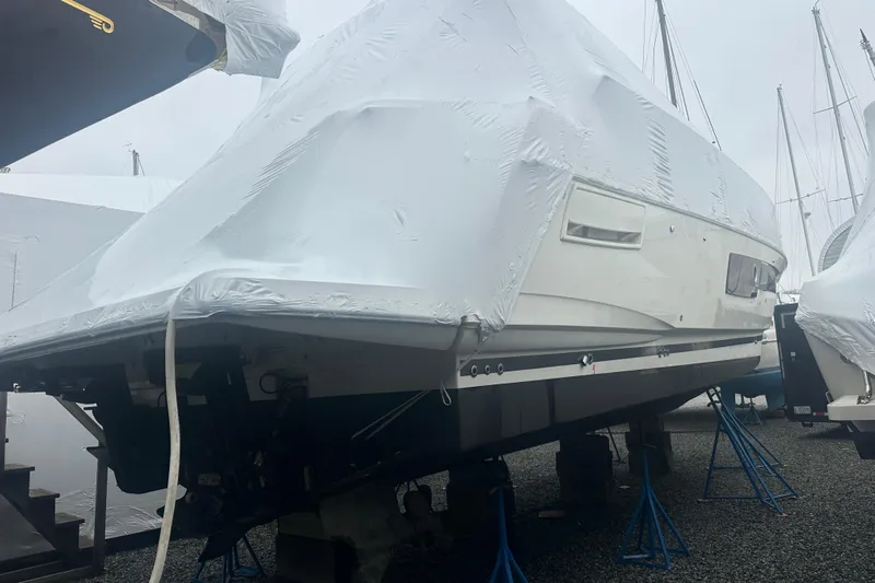 World Wide Yacht Photos Pics Covered 2020 Prestige 460 yacht on stands in a boatyard.