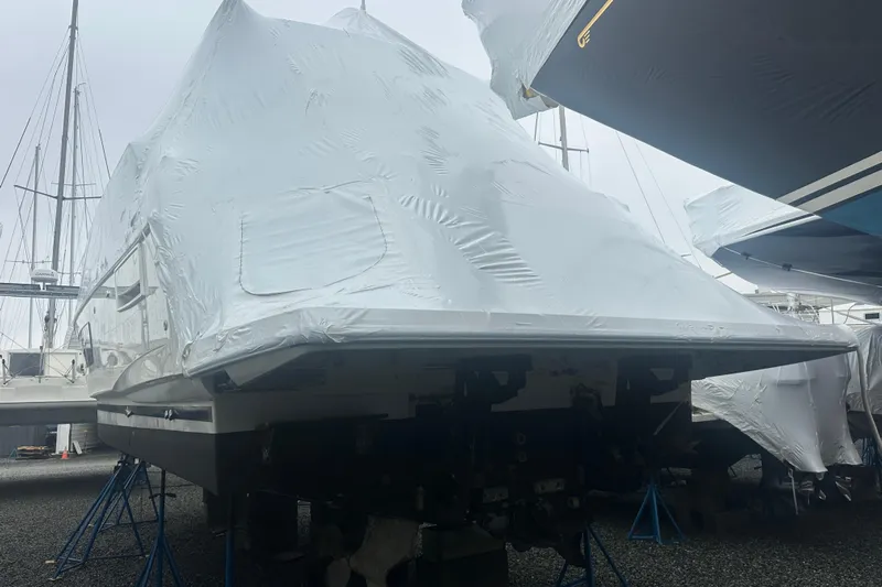 World Wide Yacht Photos Pics Covered 2020 Prestige 460 yacht in storage, supported by stands.