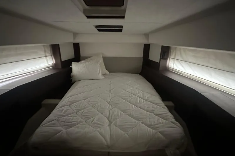 World Wide Yacht Photos Pics Luxurious cabin interior of 2020 Prestige 460 yacht with cozy bed and soft lighting.