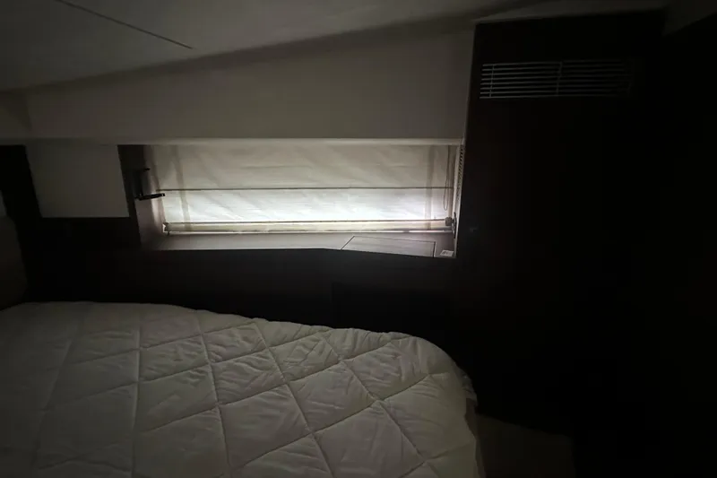 World Wide Yacht Photos Pics Interior cabin of 2020 Prestige 460 yacht with bed and window shade.