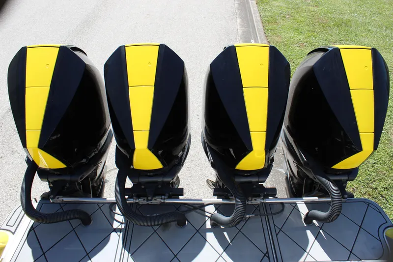  Yacht Photos Pics Four black and yellow outboard motors on a Mystic M4200, 2021 model.