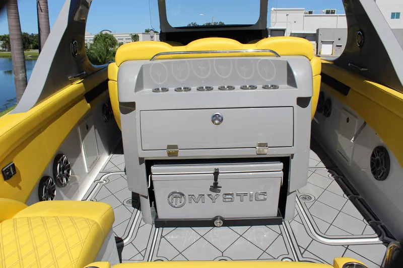  Yacht Photos Pics Interior of 2021 Mystic M4200 boat with yellow seating and storage compartments.