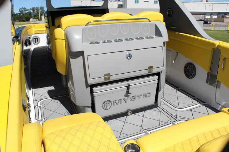  Yacht Photos Pics Yellow interior of 2021 Mystic M4200 boat with seating and storage.