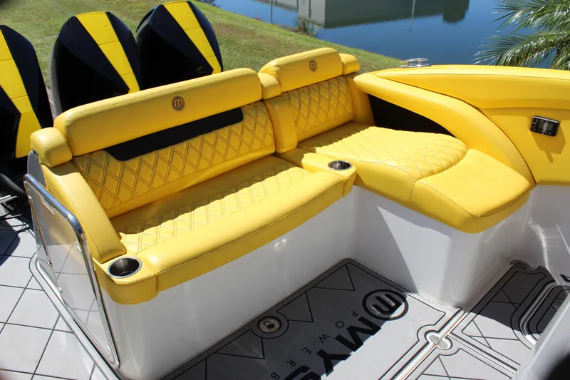  Yacht Photos Pics Yellow seating on 2021 Mystic M4200 boat with quilted design and cup holders.