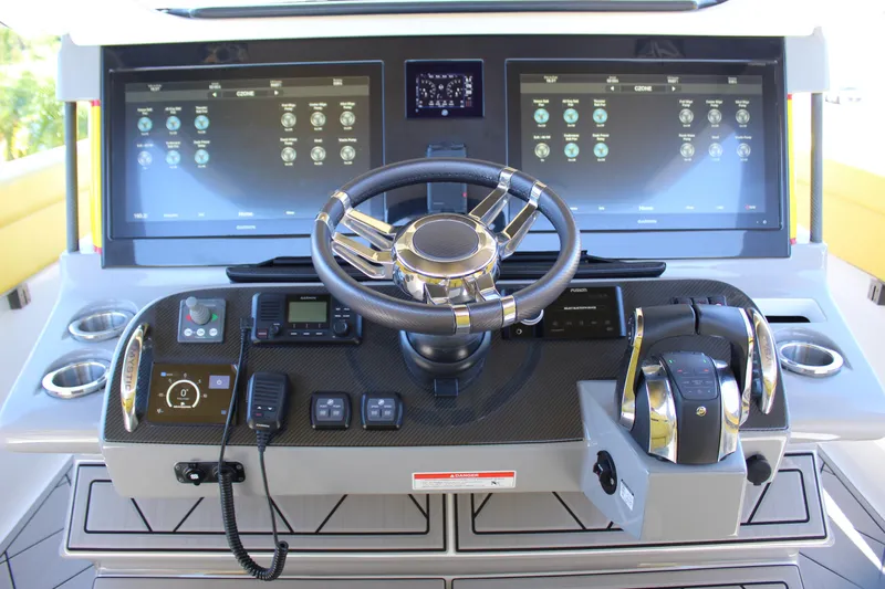  Yacht Photos Pics Cockpit of 2021 Mystic M4200 boat with advanced navigation and control systems.