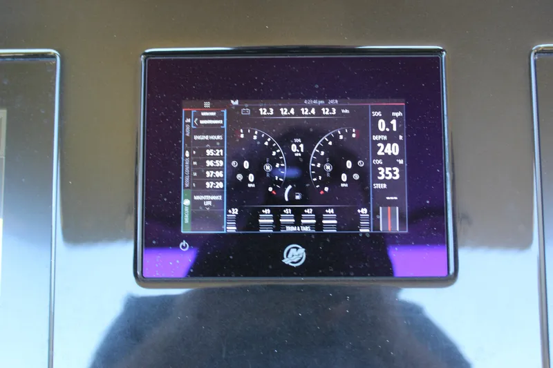 Yacht Photos Pics Dashboard display of a 2021 Mystic M4200 boat showing engine and navigation data.