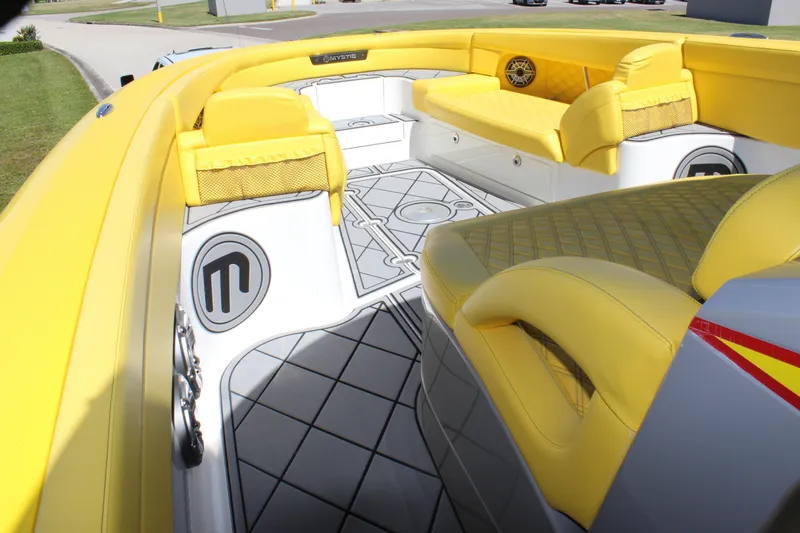  Yacht Photos Pics Yellow interior of 2021 Mystic M4200 boat with stylish seating and flooring.