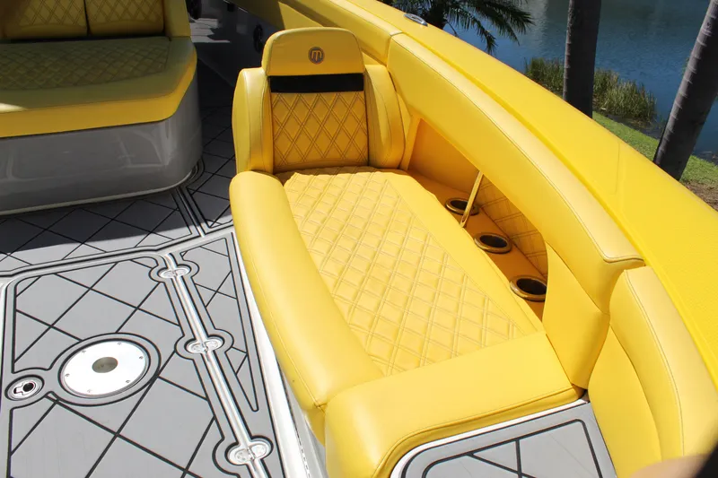  Yacht Photos Pics Yellow seating on 2021 Mystic M4200 boat with quilted design and cup holders.