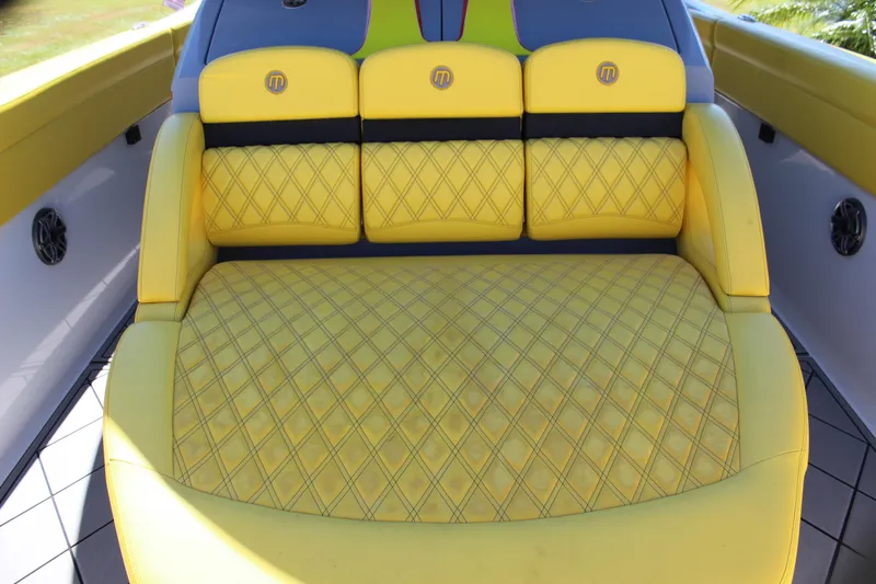  Yacht Photos Pics Yellow quilted seating on 2021 Mystic M4200 boat, featuring stylish design and comfort.