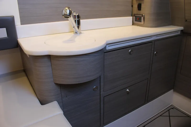  Yacht Photos Pics Modern bathroom vanity in Mystic M4200, 2021 model, featuring sleek cabinetry and chrome faucet.
