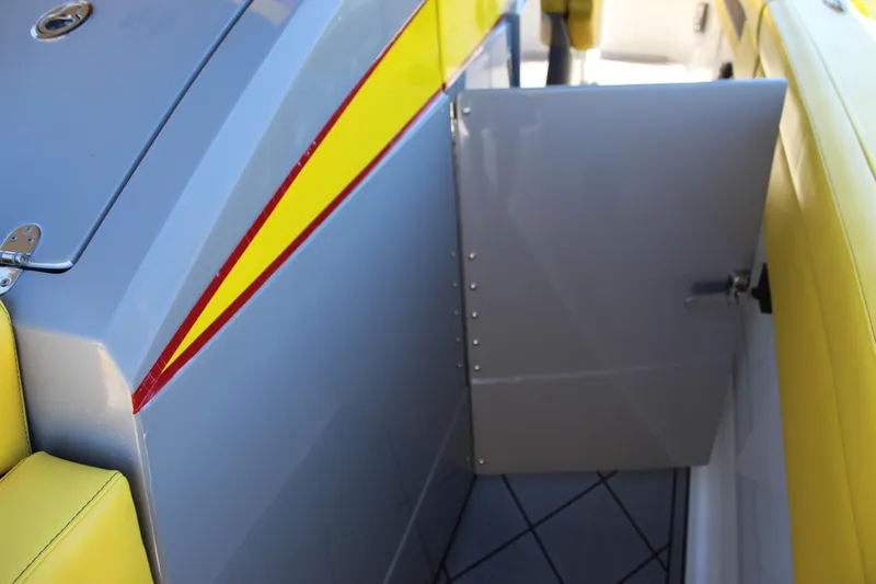  Yacht Photos Pics Yellow and gray interior of 2021 Mystic M4200 boat with open door.