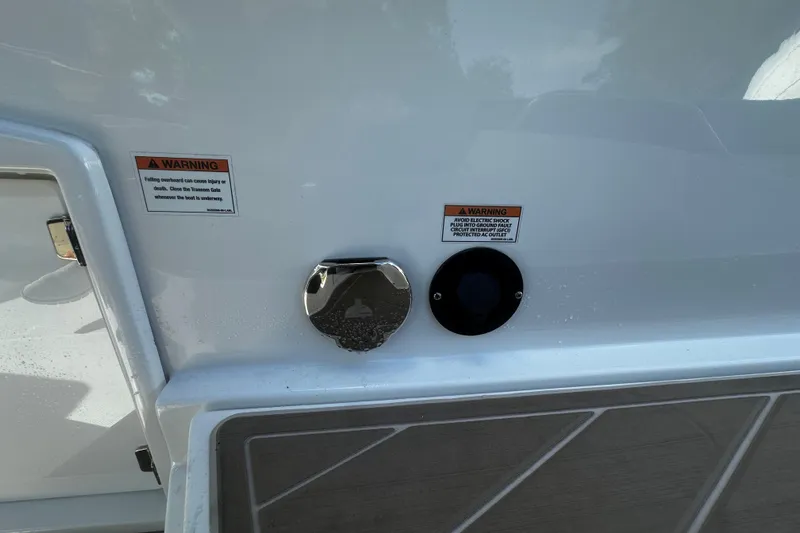  Yacht Photos Pics 2023 Monterey 305SS Super Sport boat with warning labels and deck details.