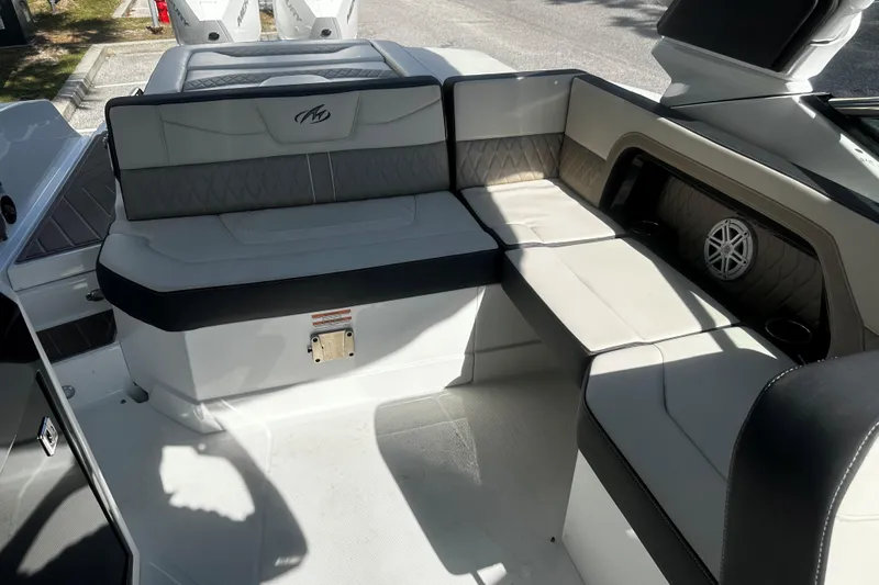  Yacht Photos Pics 2023 Monterey 305SS Super Sport boat interior with cushioned seating and speaker system.