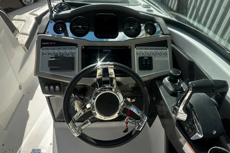  Yacht Photos Pics Cockpit of 2023 Monterey 305SS Super Sport boat with modern controls and steering wheel.