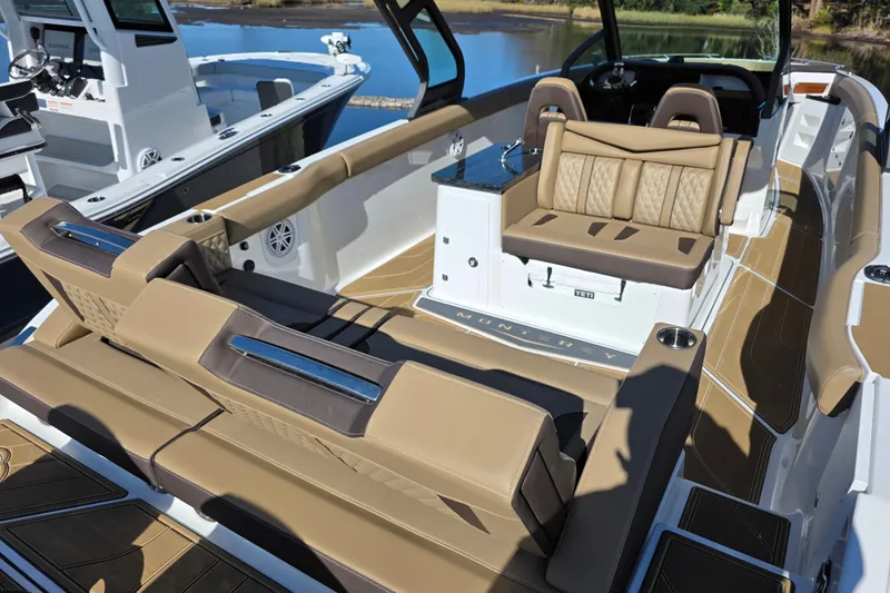  Yacht Photos Pics 2026 Monterey Elite 30 OB boat interior with luxurious tan seating and modern design.