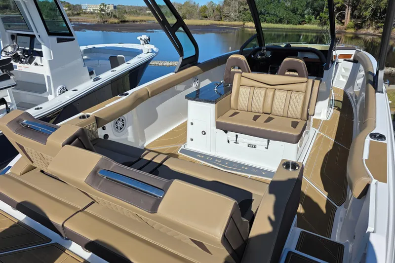  Yacht Photos Pics 2026 Monterey Elite 30 OB boat interior with tan seating and modern design.