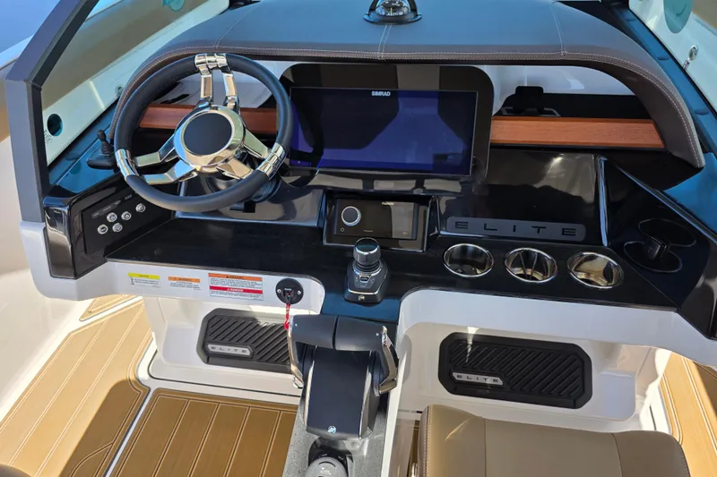  Yacht Photos Pics 2026 Monterey Elite 30 OB boat dashboard with modern steering and control panel.